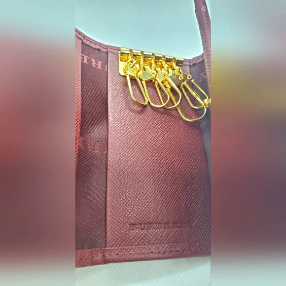 BURBERRY- Burgundy Key Holder with Gold Accents -Like-New -